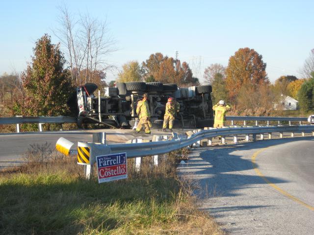 An overturned cement truck on the southbound on-ramp to Route 1.